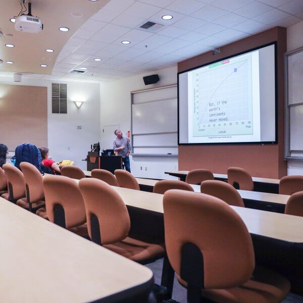 Matthew Kirby teaches an almost empty classroom