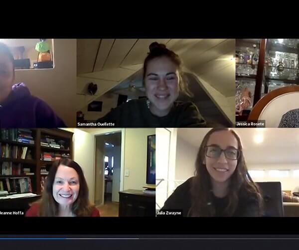 six women smiling during a video zoom call